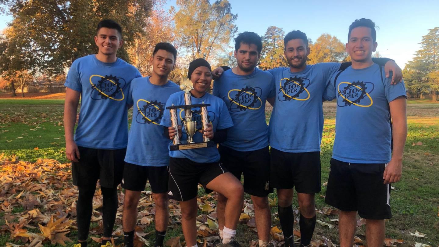 SOLES team with trophy 